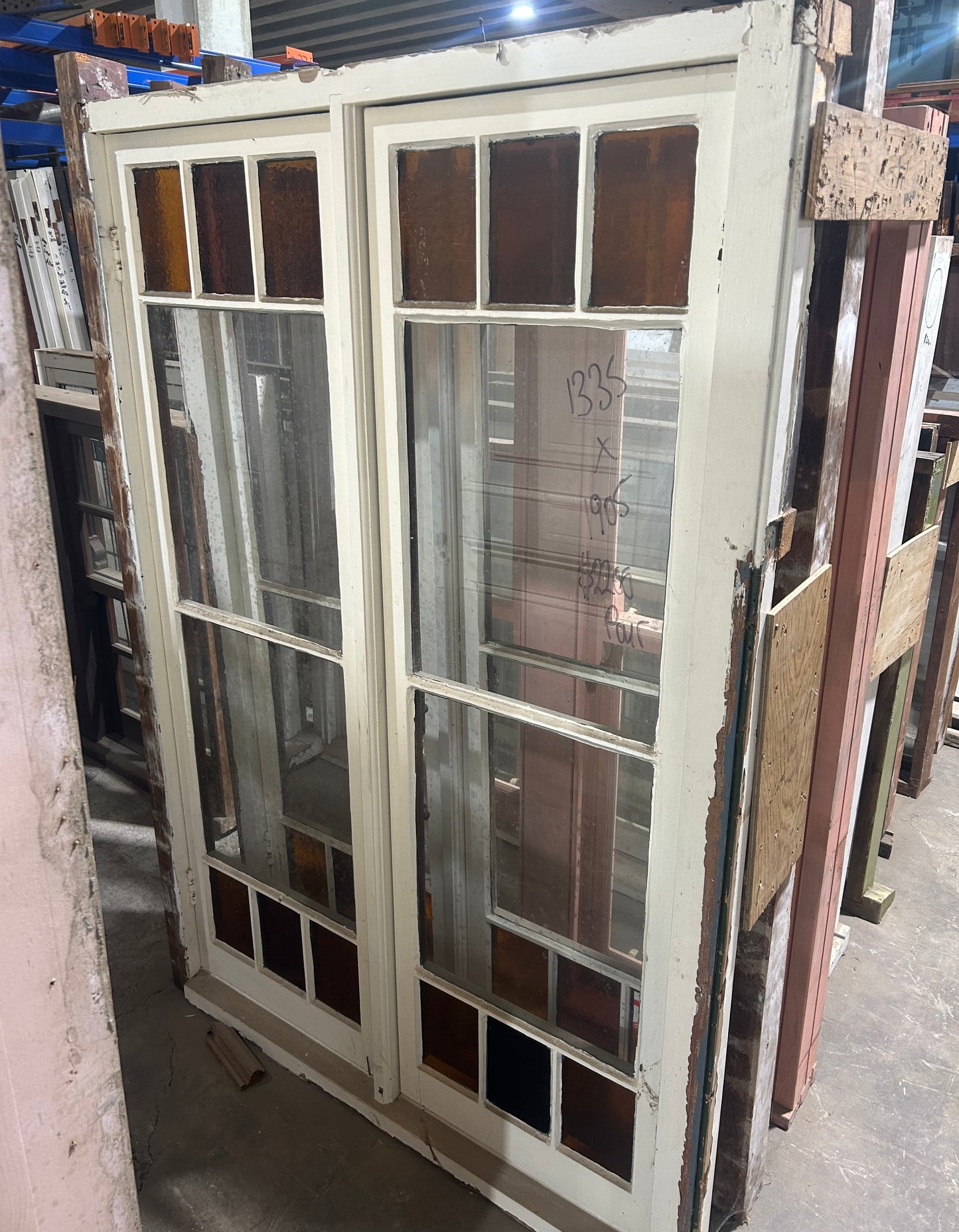 An original salvaged four-panel solid timber internal door with a painted finish on display at Chippendale Restorations.