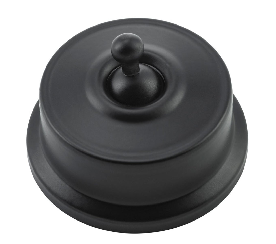 Close-up of a Federation Light Switch with a square or rectangular plate and a decorative edge, featuring a classic toggle or dolly switch, shown in a heritage metal finish.