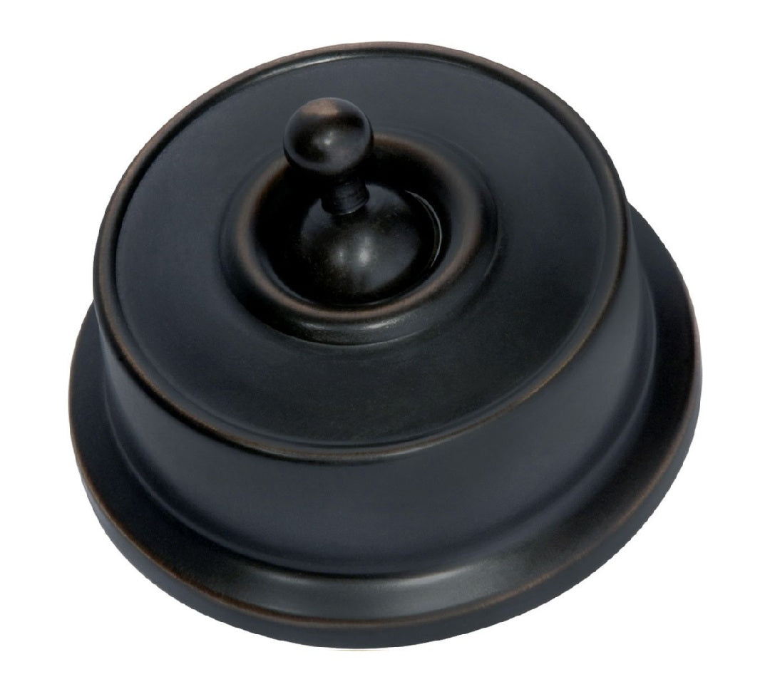 Close-up of a Federation Light Switch with a square or rectangular plate and a decorative edge, featuring a classic toggle or dolly switch, shown in a heritage metal finish.