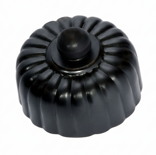 Detailed view of a Fluted Fan Controller with a ridged, textured control knob and a coordinating smooth or stepped round base plate, shown in a polished metal finish.