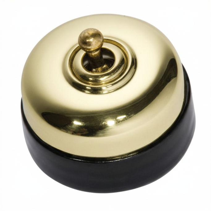 Porcelain-based electrical switch with a visible metal dolly. Available in a polished brass or antique brass finish on either a white porcelain base or a black porcelain base.