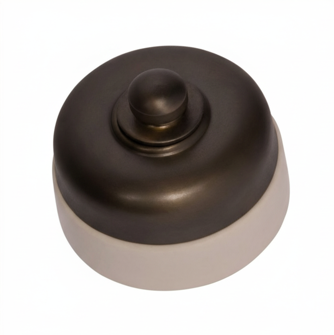 Close-up of a round Porcelain Base Fan Controller mounted on a wall. The switch has a central control knob, and the distinctive white ceramic base is visible against the wall surface.