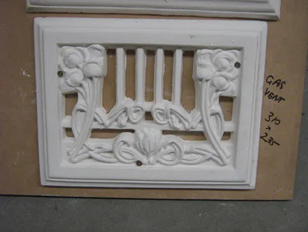 Sydney A close-up of a new white decorative plaster wall or ceiling vent with an ornate, traditional pattern.