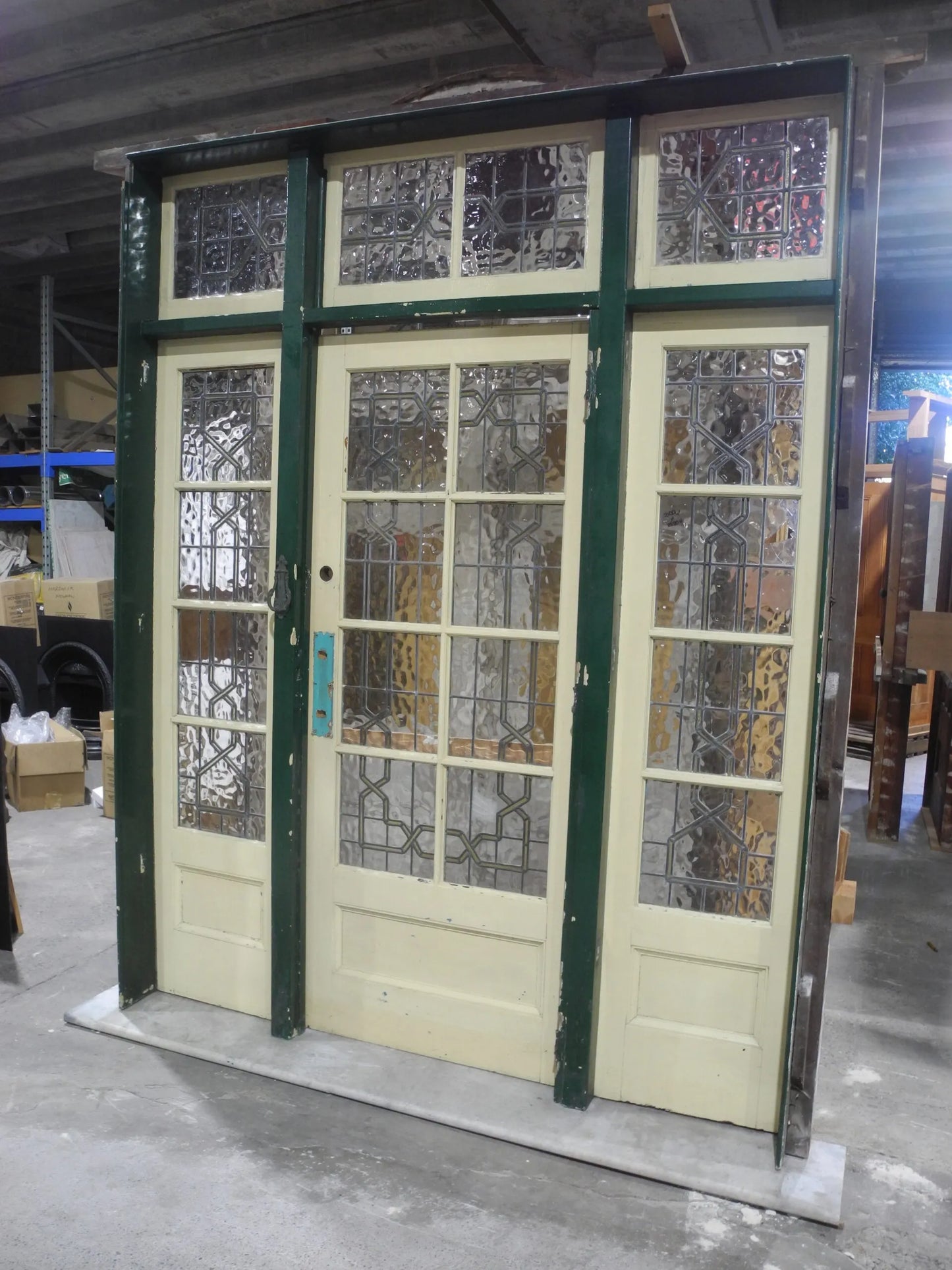 Original Arts and Crafts solid timber front entry door featuring high-set stylized floral leadlight glass panels from Chippendale Restorations second hand doors yard.