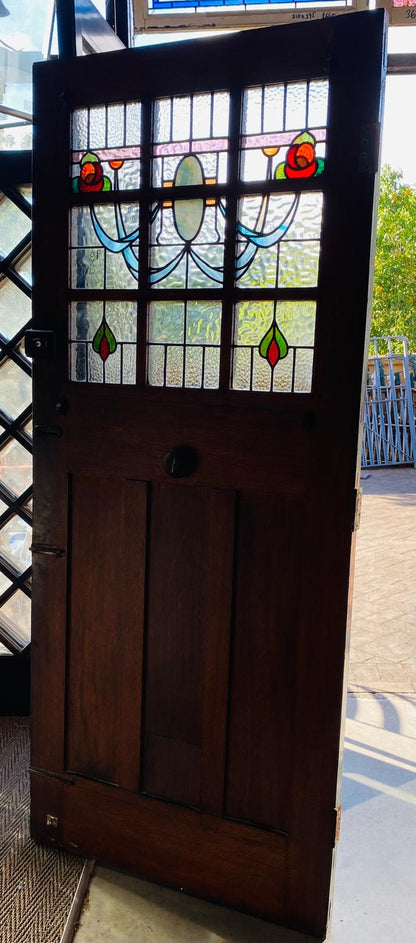 Stately pair of 1920s solid timber front doors with multi-textured geometric leadlight glass panels from Chippendale Restorations second hand doors warehouse.