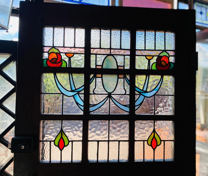 Stately pair of 1920s solid timber front doors with multi-textured geometric leadlight glass panels from Chippendale Restorations second hand doors warehouse.