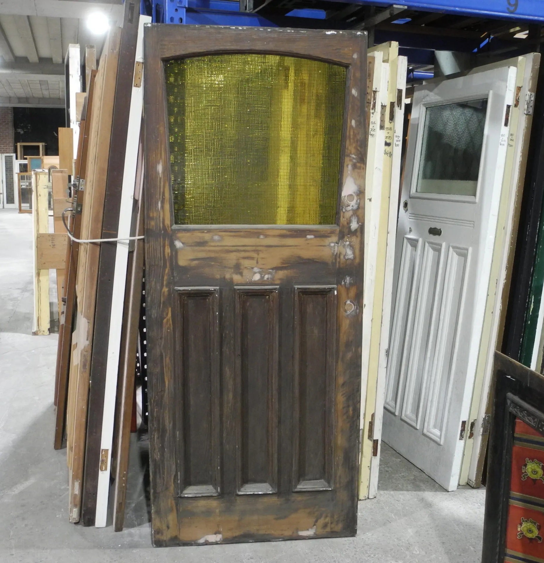 Original 1920s Edwardian solid timber front door featuring a geometric diamond leadlight glass window, available to buy at Chippendale Restorations second hand doors.