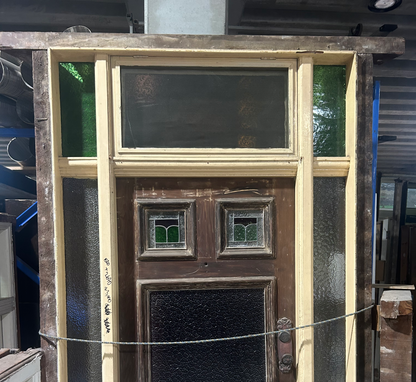 Authentic white Federation timber front door featuring high-set geometric textured leadlight privacy glass windows from Chippendale Restorations second hand doors yard.