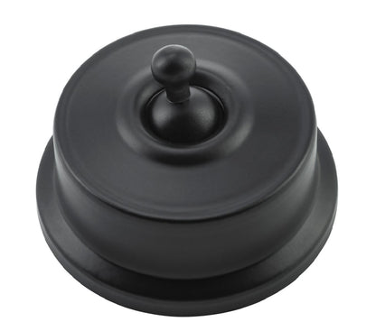 Close-up of a Federation Light Switch with a square or rectangular plate and a decorative edge, featuring a classic toggle or dolly switch, shown in a heritage metal finish.