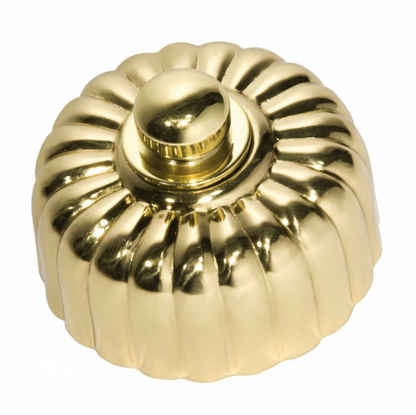 Detailed view of a Fluted Fan Controller with a ridged, textured control knob and a coordinating smooth or stepped round base plate, shown in a polished metal finish.