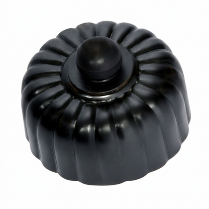 Detailed view of a Fluted Fan Controller with a ridged, textured control knob and a coordinating smooth or stepped round base plate, shown in a polished metal finish.