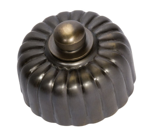 Close-up of a Fluted LED Dimmer switch with a textured, ridged knob and circular base plate, shown in a polished metal finish (e.g., polished brass or chrome).