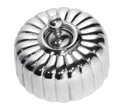 Close-up of a Fluted Light Switch wall plate and dolly switch, distinguished by its unique vertical ridged/ribbed design and presented in a polished or brushed metal finish.