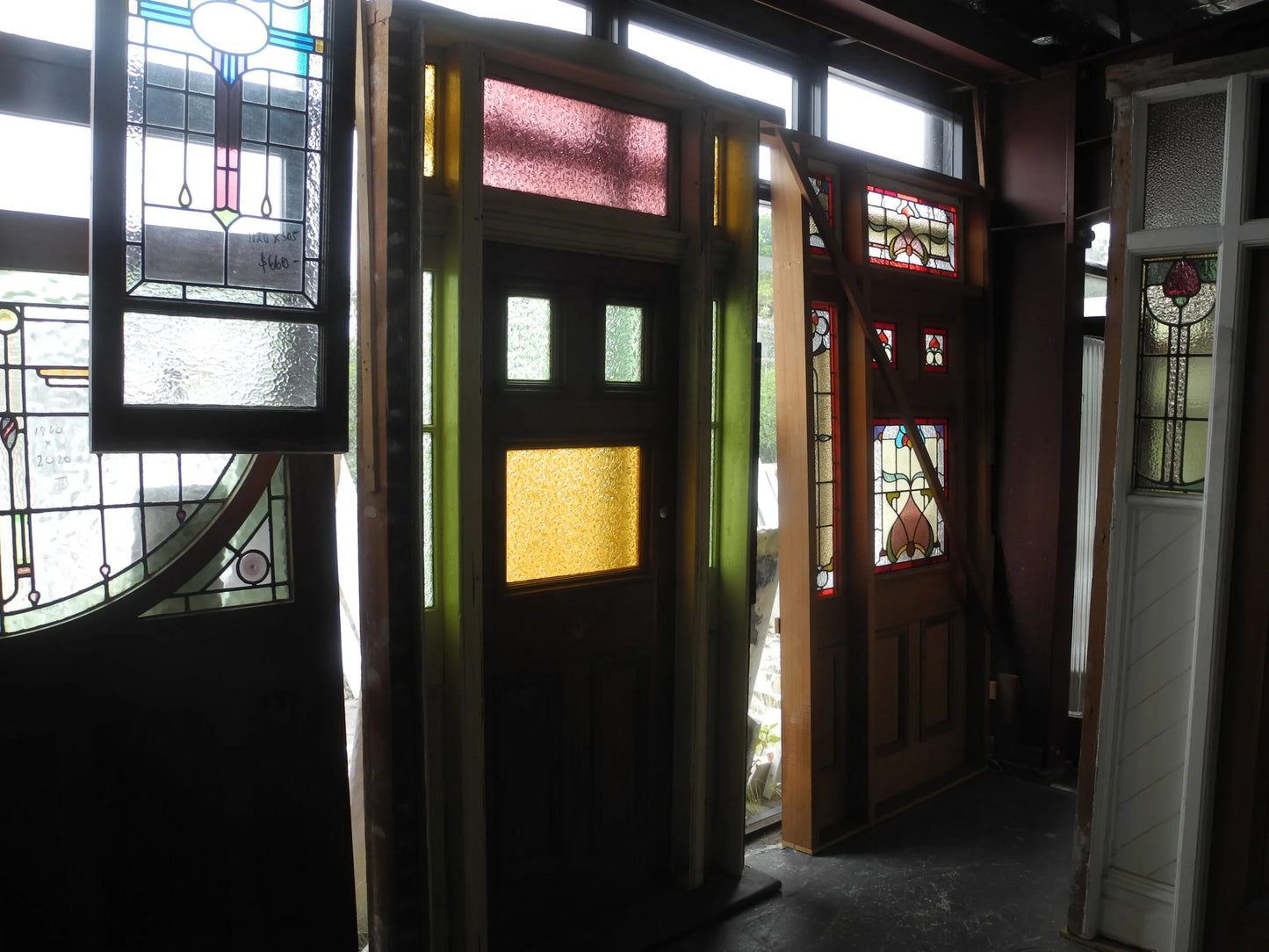 Antique Federation front entranceway door featuring vibrant red and yellow leadlight stained glass panels from Chippendale Restorations second hand doors.