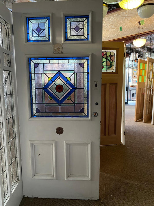 Antique solid timber Federation style door featuring a decorative stained glass entryway insert, available to buy at Chippendale Restorations.