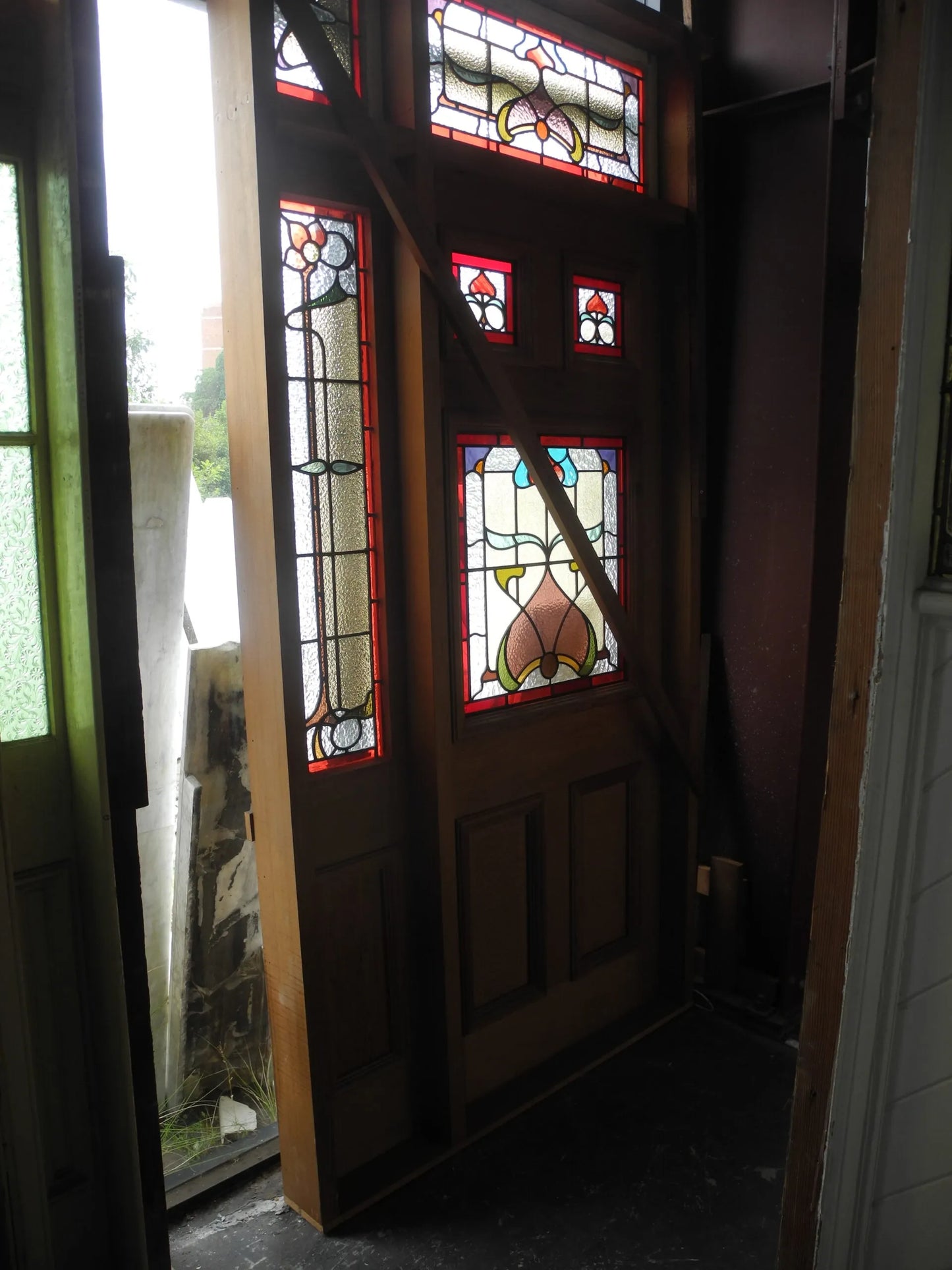 Antique Federation leadlight entranceway door with vibrant red, yellow, and blue stained glass panels from Chippendale Restorations second hand doors collection.