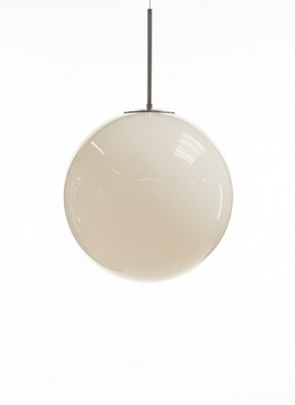 Spherical white glass globe pendant light hanging from a metal ceiling rose and rod, with a blurred background.