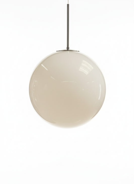 Spherical white glass globe pendant light hanging from a metal ceiling rose and rod, with a blurred background.