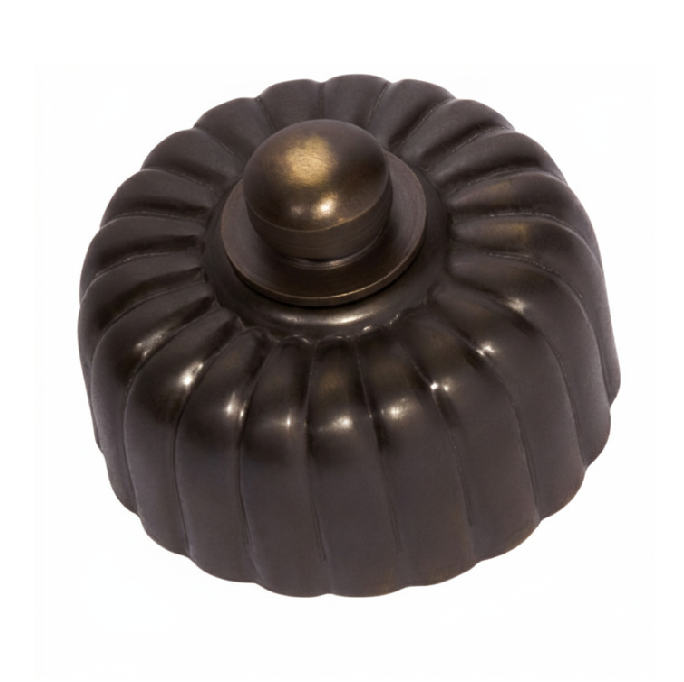 Detailed view of a Fluted Fan Controller with a ridged, textured control knob and a coordinating smooth or stepped round base plate, shown in a polished metal finish.