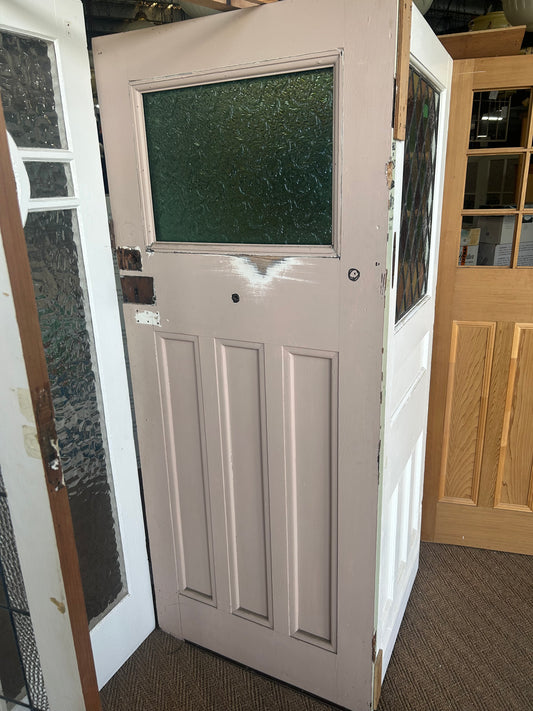 An original salvaged four-panel Edwardian timber internal door painted white, showcasing traditional deep-moulded panels on display at Chippendale Restorations.