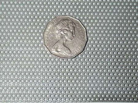 A close-up of a new, high-quality, corrosion-resistant zinc or galvanised wire mesh panel with small, tightly woven squares, ready to be cut to custom size for construction or screening applications in a coastal environment.