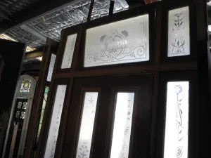 Backlit view of a Victorian entry door showing intricate frosted and etched glass floral patterns, available to buy at Chippendale Restorations.