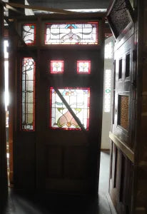 Solid timber Federation front door set with intricate leadlight glass inserts available at Chippendale Restorations for architectural salvage buyers.