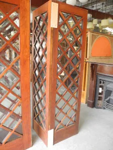 Close-up view of weathered timber framing and individual glass lites on salvaged internal French doors from Chippendale Restorations.
