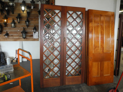 Matching pair of classic multi-pane glass internal timber French doors, available to buy at Chippendale Restorations second hand doors yard.